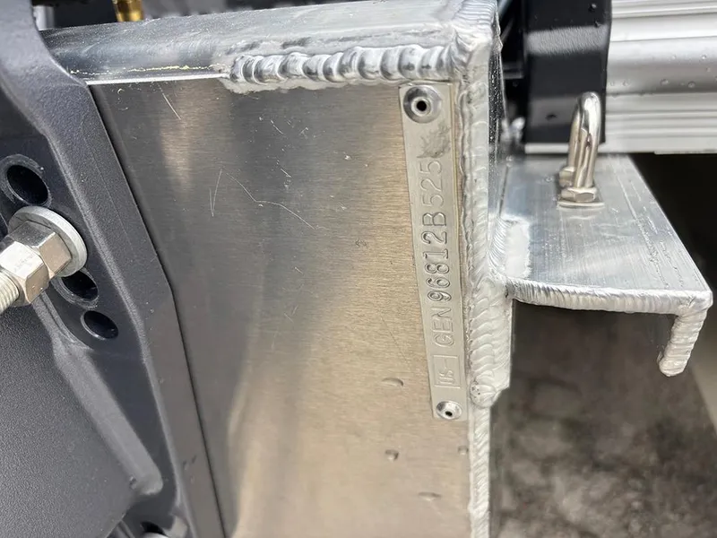 Slide: The Image of Close-up of SunCatcher Select 322RF 2025 metal component with visible welds and serial number. - 31