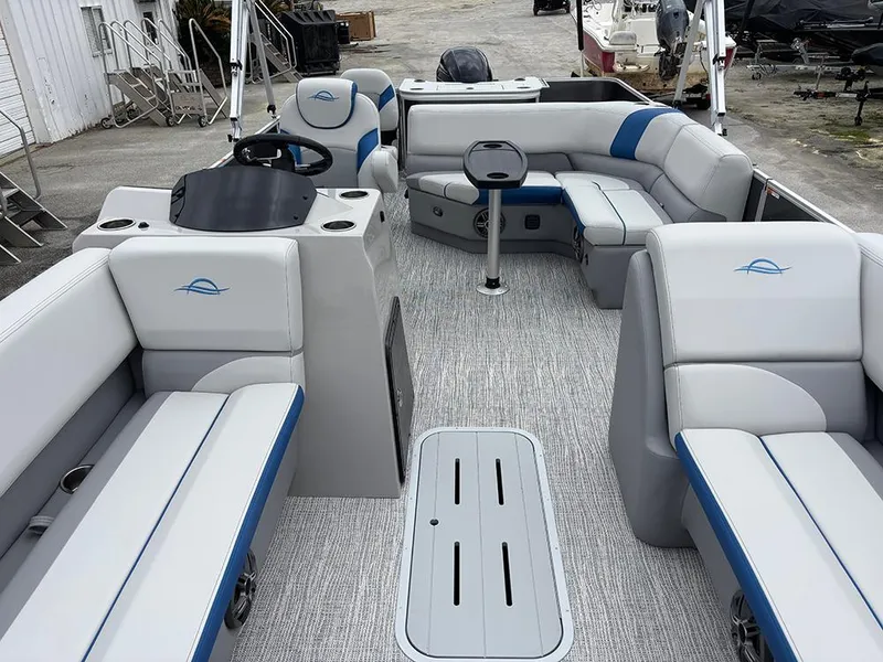 Slide: The Image of 2025 SunCatcher Select 322RF pontoon boat interior with plush seating and modern design. - 9