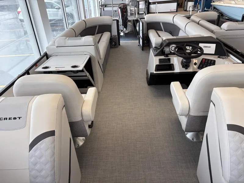 Slide: The Image of Interior of 2025 Crest 240SLC boat with luxurious seating and modern helm. - 3