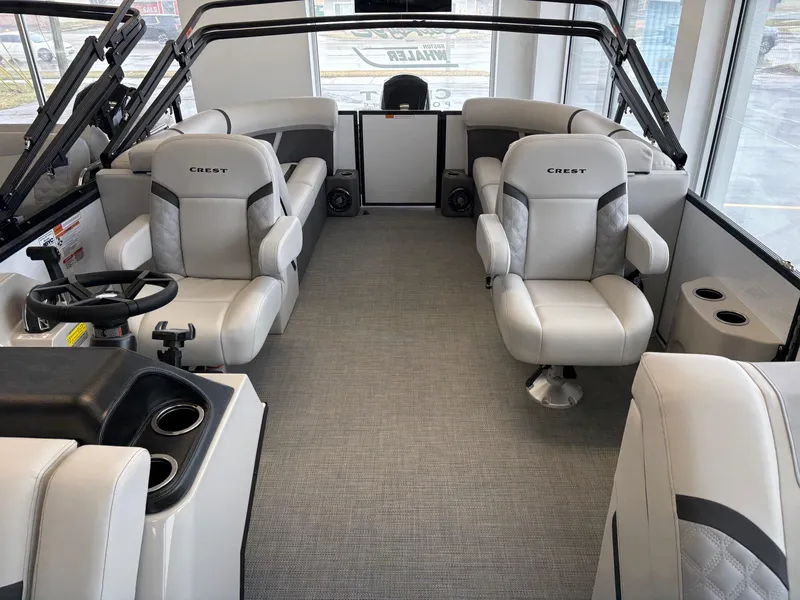 Slide: The Image of 2025 Crest 240SLC boat interior with luxurious seating and modern design. - 7