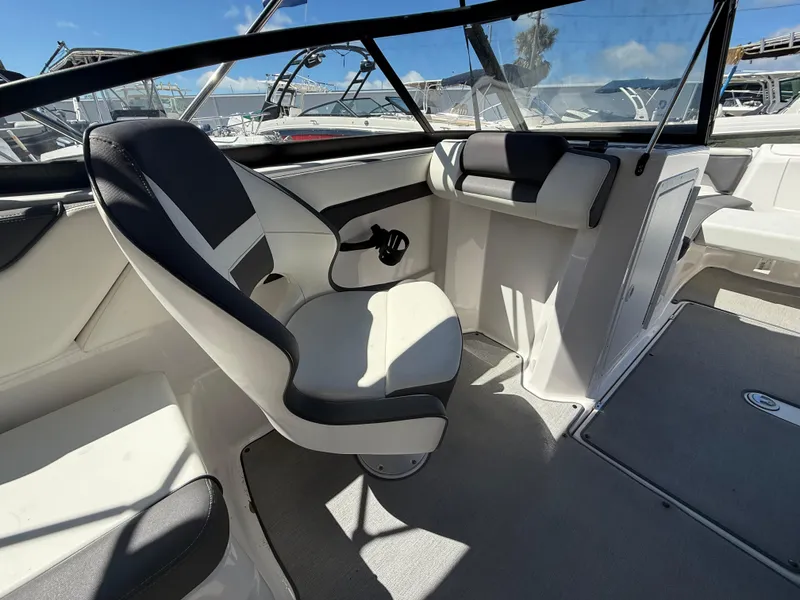 Slide: The Image of 2022 Yamaha Boats SX210 interior with sleek seating and modern design. - 10