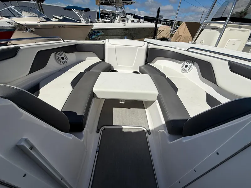 Slide: The Image of 2022 Yamaha Boats SX210 interior with spacious seating and modern design. - 11