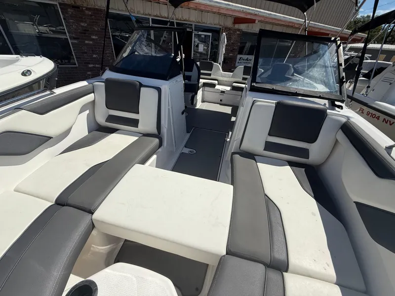 Slide: The Image of 2022 Yamaha Boats SX210 interior with sleek seating and modern design. - 12