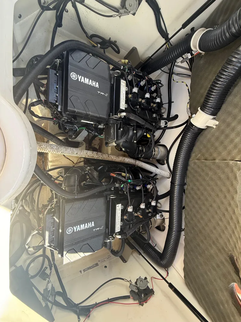 Slide: The Image of 2022 Yamaha SX210 boat engines, showcasing dual Yamaha motors and intricate wiring. - 13