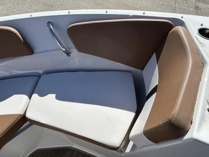 Slide: The Image of 2017 Four Winns Horizon 190 boat interior with brown and white cushioned seating. - 14