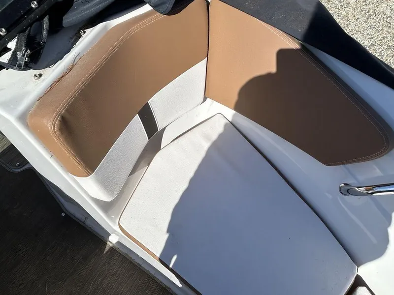 Slide: The Image of 2017 Four Winns Horizon 190 boat interior with brown and white seating. - 15