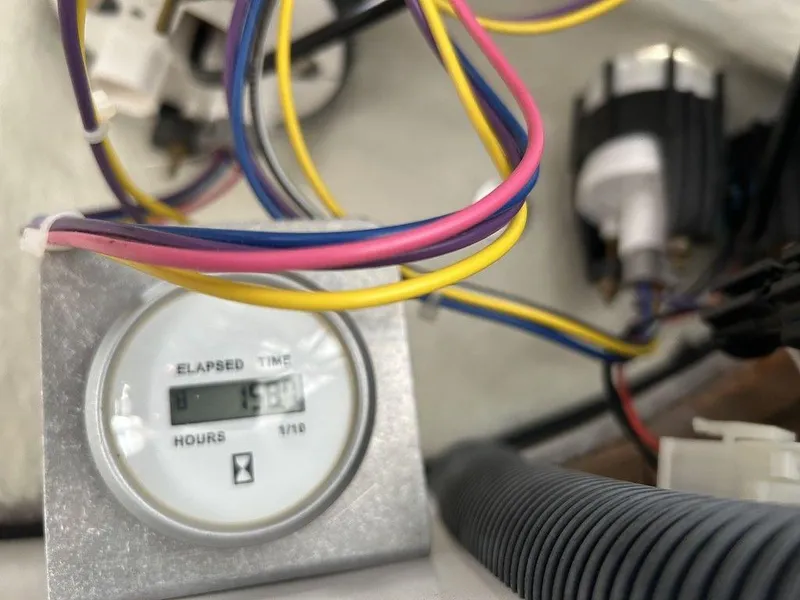 Slide: The Image of Hour meter with colorful wires in a 2017 Four Winns Horizon 190 boat. - 16