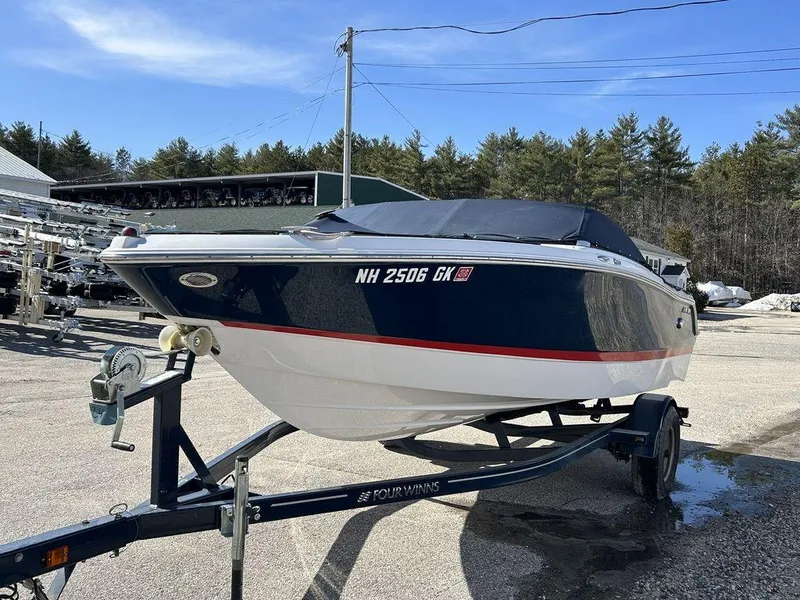 Slide: The Image of 2017 Four Winns Horizon 190 boat on trailer, covered, parked outdoors. - 3