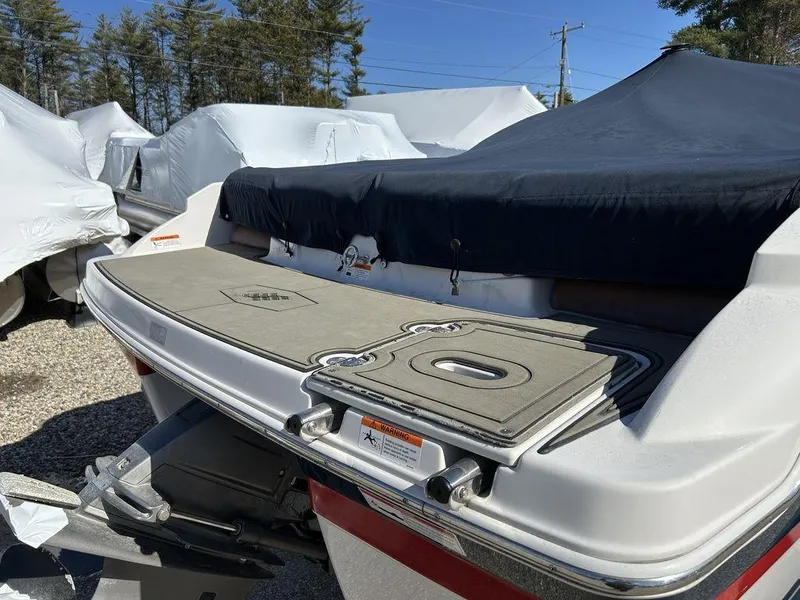 Slide: The Image of 2017 Four Winns Horizon 190 boat with covered deck, parked outdoors. - 4