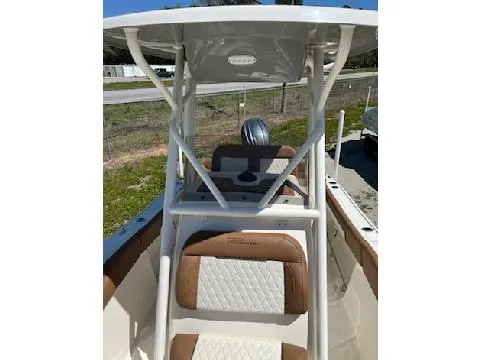 Slide: The Image of 2025 Pioneer 202 Islander boat with cushioned seating and T-top canopy. - 5