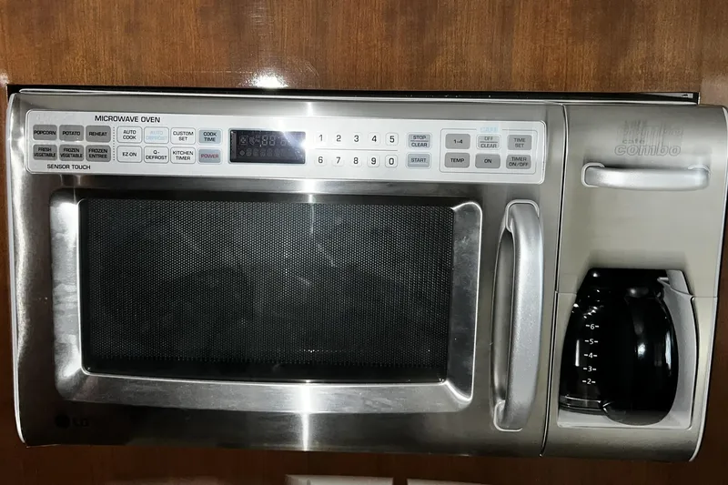 Slide: The Image of Built-in microwave and coffee maker in a 2008 Carver 36 Mariner yacht kitchen. - 13