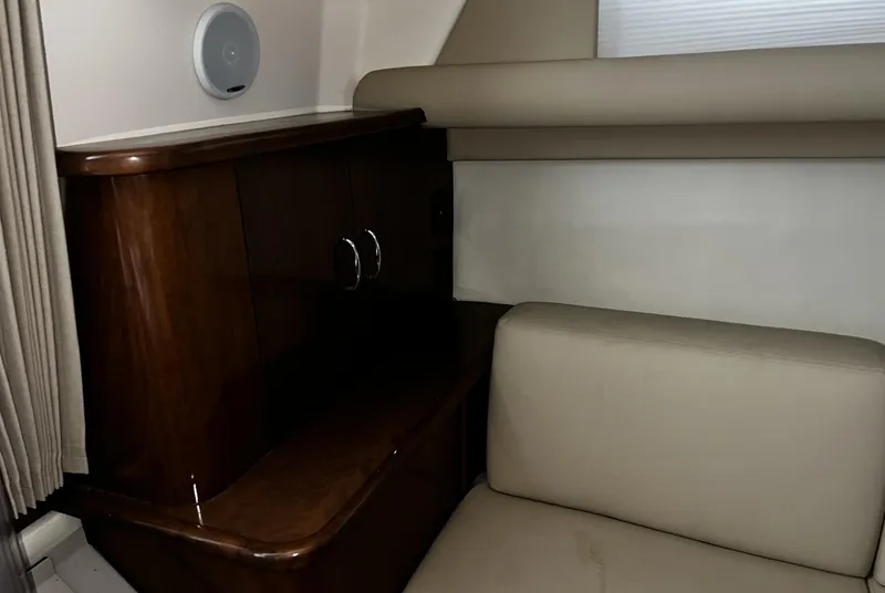 Slide: The Image of Interior of 2008 Carver 36 Mariner with wood cabinet and beige seating. - 14