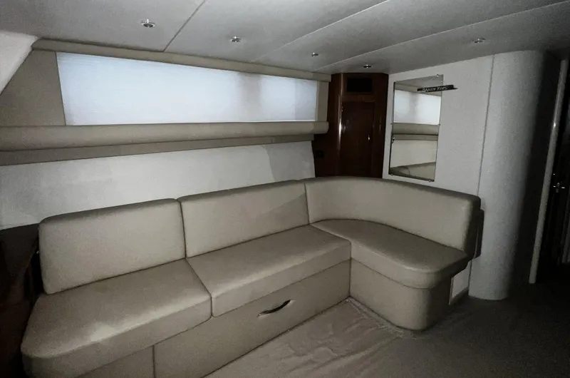 Slide: The Image of 2008 Carver 36 Mariner interior with beige L-shaped sofa and modern design. - 16