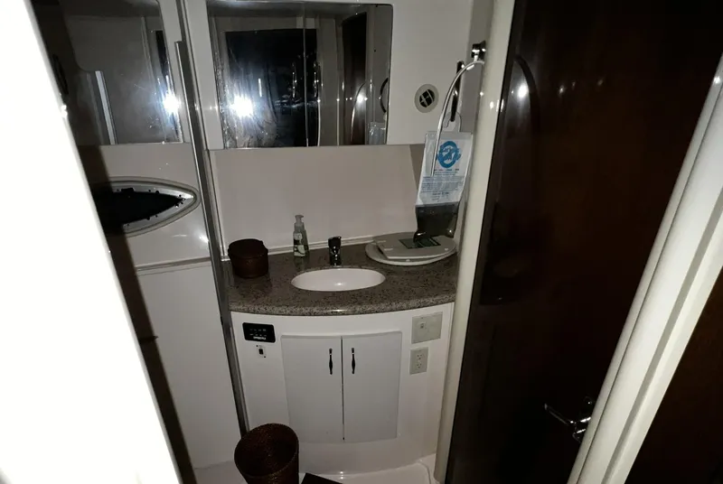 Slide: The Image of 2008 Carver 36 Mariner bathroom with sink, mirror, and storage cabinets. - 20