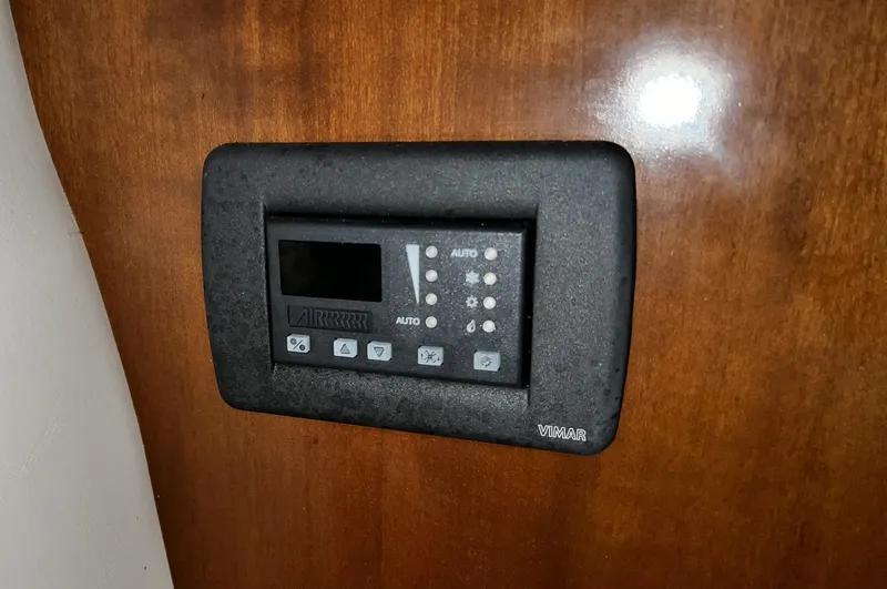 Slide: The Image of Control panel on 2008 Carver 36 Mariner boat, mounted on wooden surface. - 27