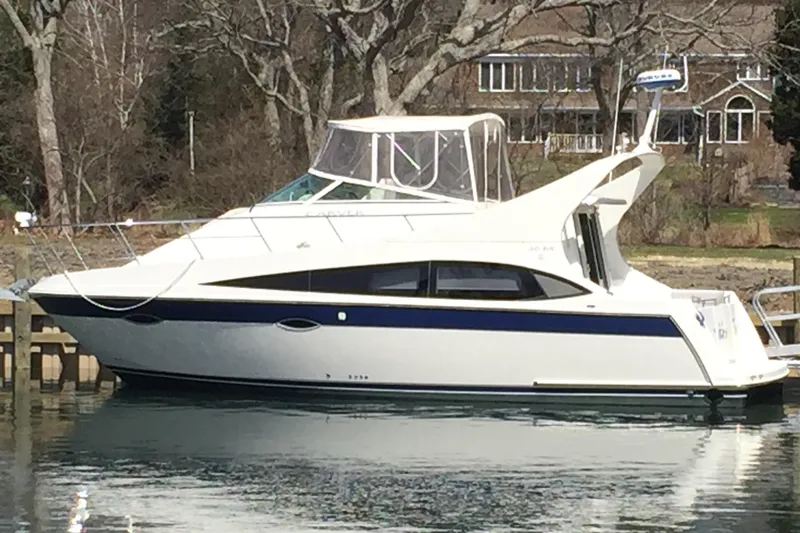 Slide: The Image of 2008 Carver 36 Mariner yacht docked on calm water. - 3