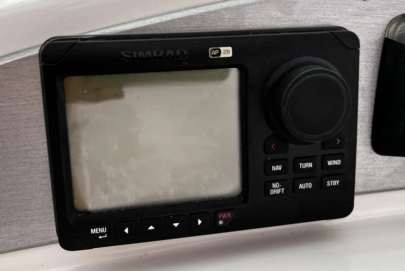 Slide: The Image of Control panel of a 2008 Carver 36 Mariner boat, featuring navigation and autopilot functions. - 30