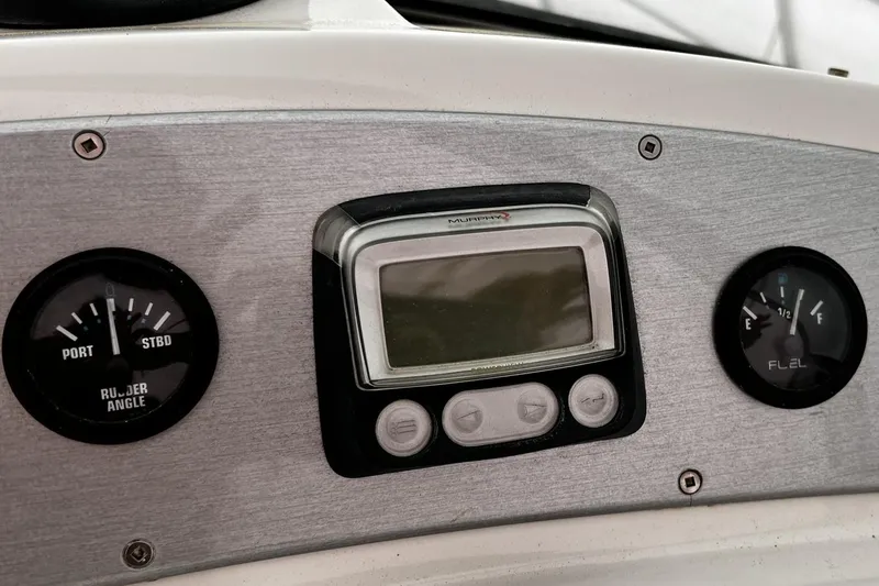 Slide: The Image of Dashboard of a 2008 Carver 36 Mariner with gauges and digital display. - 32