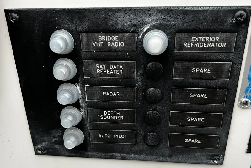 Slide: The Image of Control panel of a 2008 Carver 36 Mariner with labeled switches and buttons. - 34