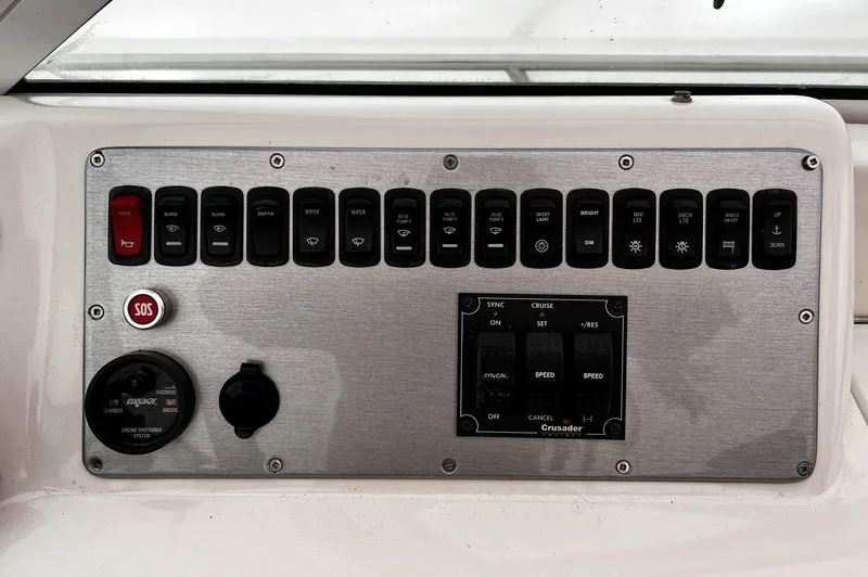 Slide: The Image of Control panel of 2008 Carver 36 Mariner boat with various switches and buttons. - 35