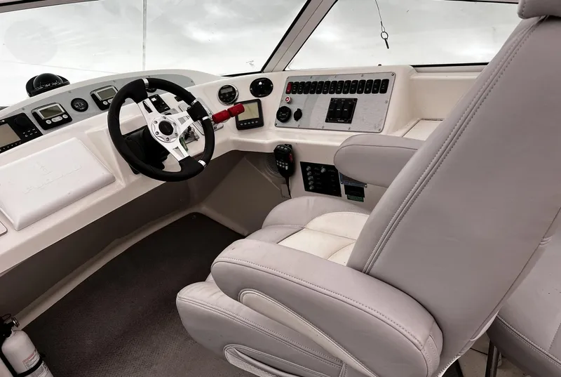 Slide: The Image of 2008 Carver 36 Mariner helm with modern controls and comfortable captain's chair. - 38