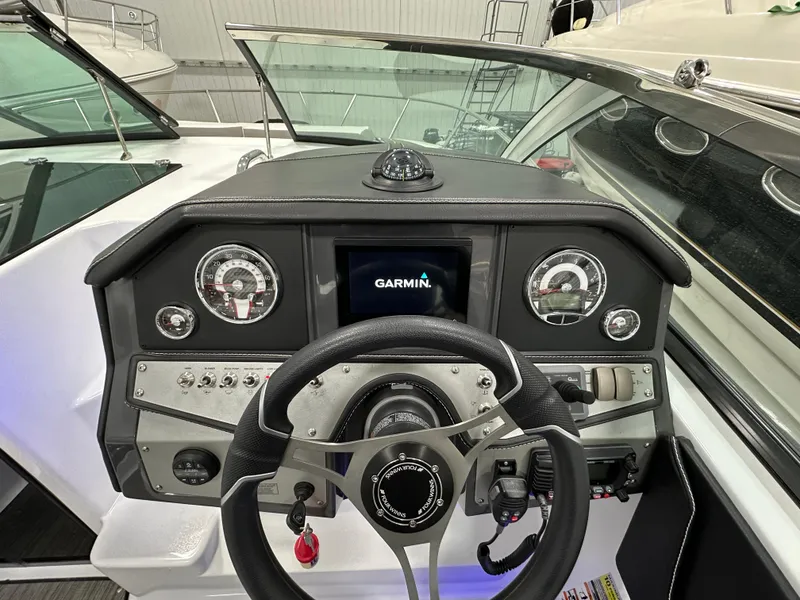 Slide: The Image of 2021 Four Winns Vista 275 dashboard with Garmin navigation system. - 12