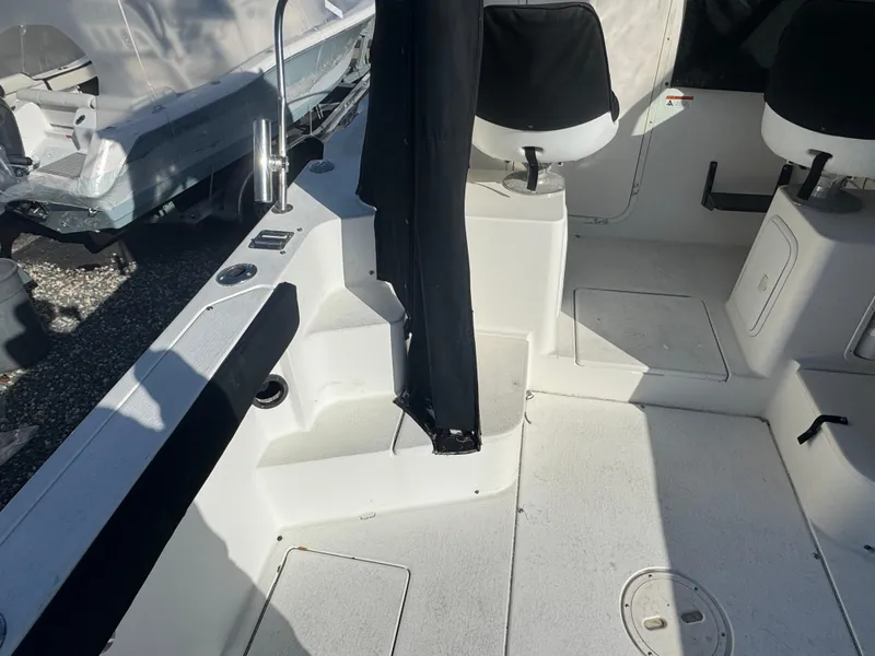 Slide: The Image of Interior cabin of 2004 Seaswirl Striper 2601 Walkaround I/O boat with porthole view. - 13