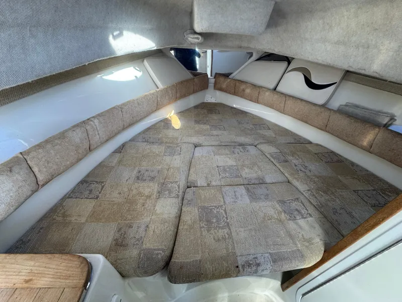 Slide: The Image of 2004 Seaswirl Striper 2601 Walkaround I/O dashboard with steering wheel and gauges. - 15