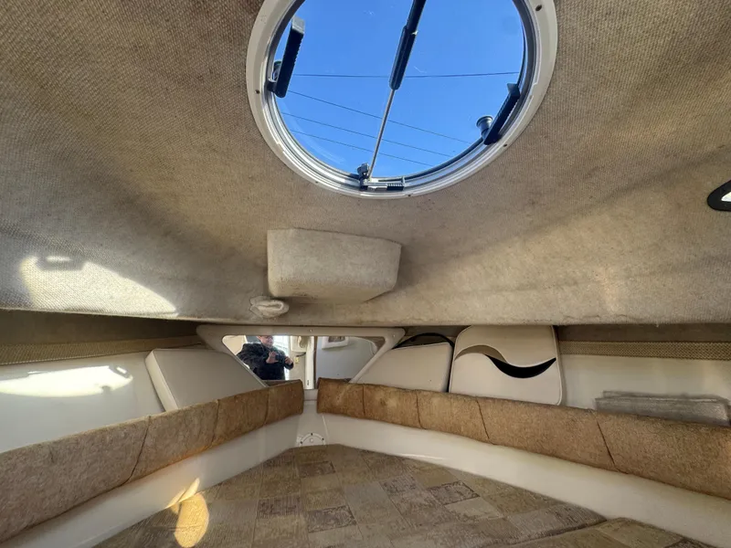 Slide: The Image of Interior cabin of 2004 Seaswirl Striper 2601 Walkaround I/O boat, featuring a closed door. - 17