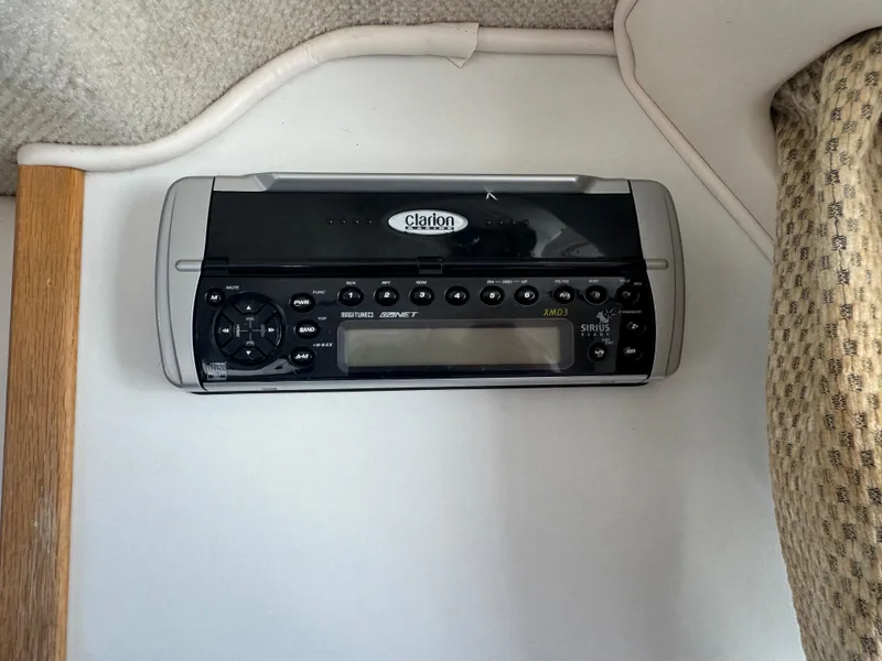 Slide: The Image of 2004 Seaswirl Striper 2601 Walkaround I/O boat interior with dashboard and rod holders. - 20