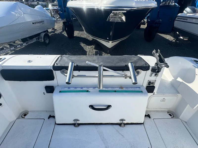 Slide: The Image of 2004 Seaswirl Striper 2601 Walkaround I/O boat wiring compartment with radio and cables. - 6