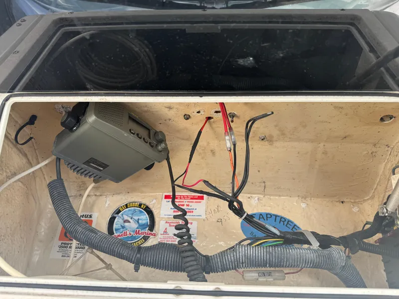 Slide: The Image of 2004 Seaswirl Striper 2601 Walkaround I/O boat interior with seating and storage compartments. - 9