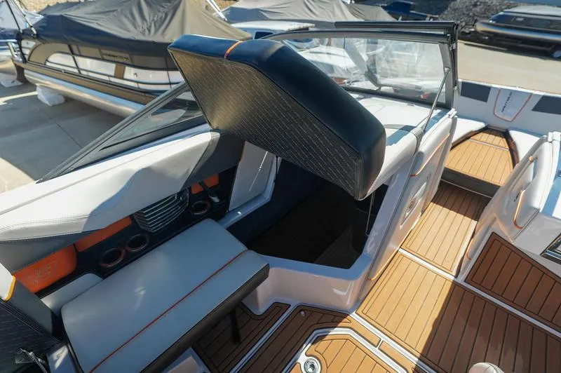 Slide: The Image of 2015 Nautique Super Air G23 interior with sleek seating and modern design. - 10