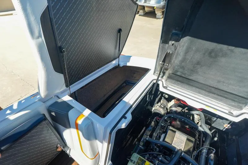 Slide: The Image of 2015 Nautique Super Air G23 engine compartment with open hatches, showcasing interior details. - 12