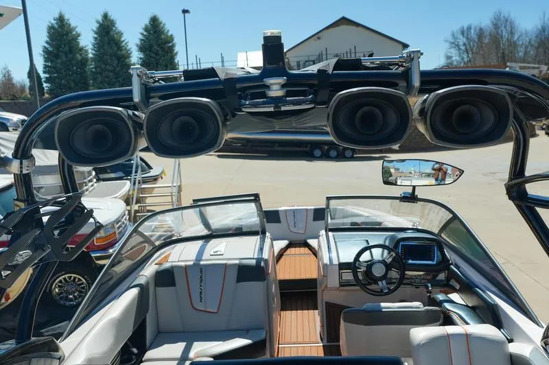 Slide: The Image of 2015 Nautique Super Air G23 interior with advanced sound system and sleek design. - 27