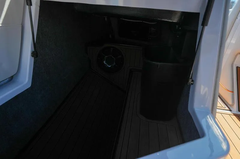 Slide: The Image of Interior storage compartment of 2015 Nautique Super Air G23 boat. - 9