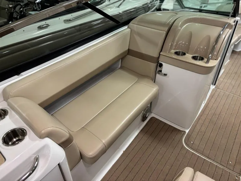 Slide: The Image of 2012 Formula 290 Bowrider interior with beige seating and cup holders. - 10