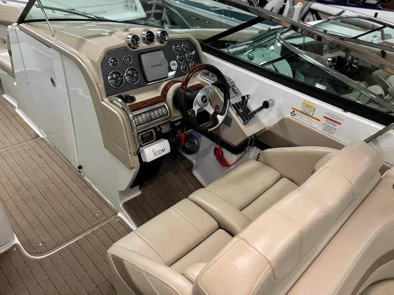 Slide: The Image of 2012 Formula 290 Bowrider interior with beige seating and modern dashboard controls. - 11