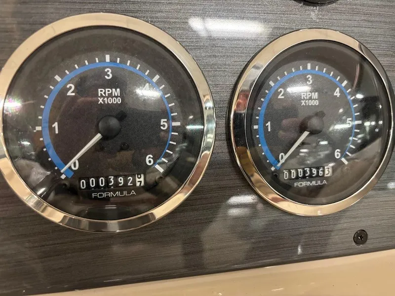Slide: The Image of Close-up of 2012 Formula 290 Bowrider RPM gauges displaying engine hours. - 14