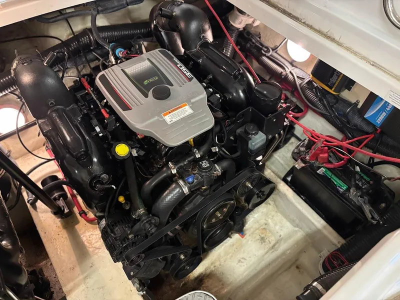 Slide: The Image of Engine compartment of a 2012 Formula 290 Bowrider boat, showcasing detailed mechanical components. - 19