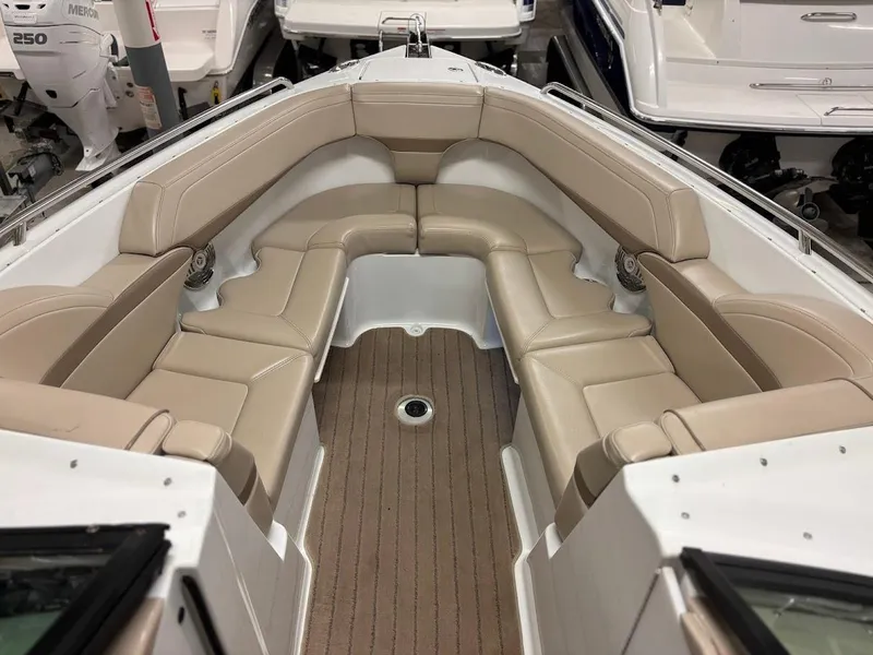 Slide: The Image of 2012 Formula 290 Bowrider interior with beige seating and wood-style flooring. - 26