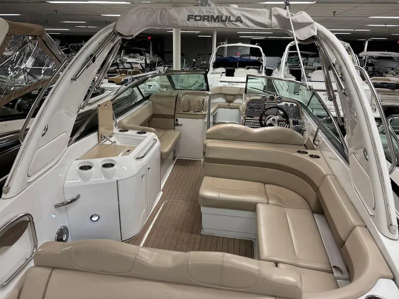 Slide: The Image of 2012 Formula 290 Bowrider with spacious seating and modern interior design. - 6