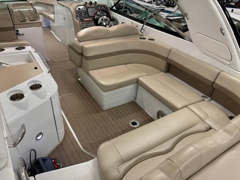 Slide: The Image of 2012 Formula 290 Bowrider interior with beige seating and modern dashboard. - 8