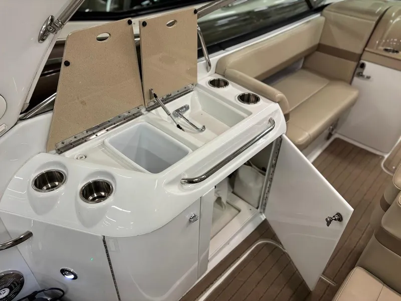 Slide: The Image of 2012 Formula 290 Bowrider interior with sink, storage, and seating area. - 9