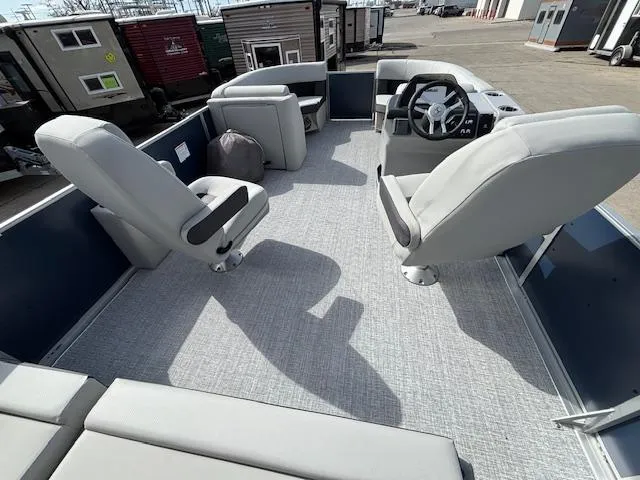 Slide: The Image of 2025 Harris Cruiser 210 SLDH pontoon boat interior with modern seating and steering console. - 12