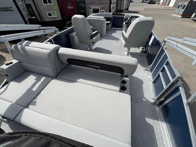 Slide: The Image of 2025 Harris Cruiser 210 SLDH pontoon boat with spacious seating and modern design. - 14