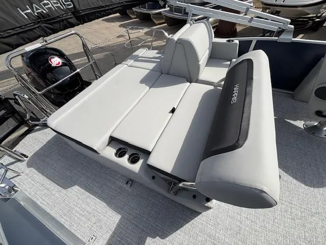 Slide: The Image of 2025 Harris Cruiser 210 SLDH boat with sleek seating and modern design. - 17