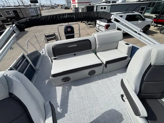 Slide: The Image of 2025 Harris Cruiser 210 SLDH pontoon boat interior with plush seating and modern design. - 20