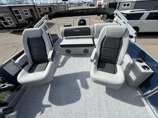 Slide: The Image of 2025 Harris Cruiser 210 SLDH boat interior with plush seating and modern design. - 21