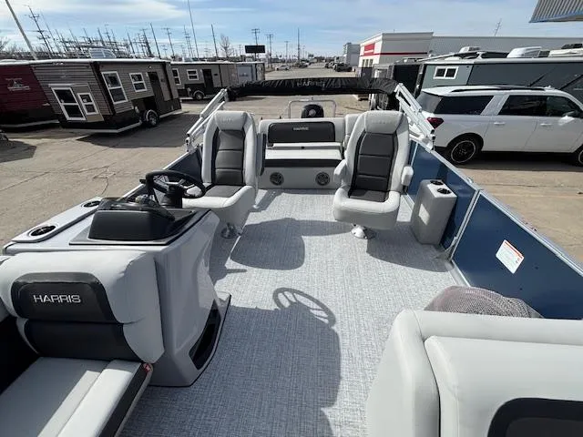 Slide: The Image of 2025 Harris Cruiser 210 SLDH pontoon boat interior with modern seating and steering console. - 22